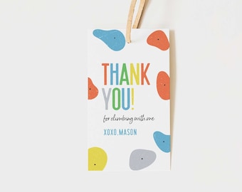 May include: A white thank you tag with colorful rock climbing holds. The tag says "Thank You! for climbing with me XOXO, Mason".