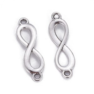 May include: Two silver-coloured infinity charm connectors. Each charm has a loop at the top and bottom for attaching to other jewellery components. The charms are made of a metal alloy and have a slightly textured surface.