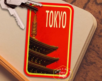 May include: A red and yellow rectangular sign with the word "TOKYO" in white lettering. The sign features a black and gold pagoda with a red roof.
