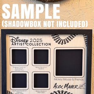 May include: A black framed Disney Artist Collection shadowbox with the text "SAMPLE (SHADOWBOX NOT INCLUDED)". The shadowbox has spaces for pins and features Mickey Mouse and Friends. The artist's signature is visible.