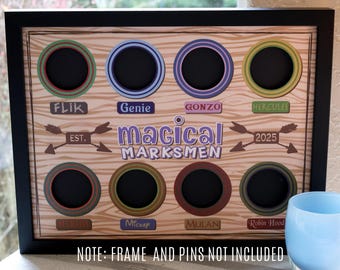 May include: A framed wooden display board with eight circular openings, each with a colored border. The board features the text "magical MARKSMEN" and character names like "Flik" and "Genie". The frame is black.