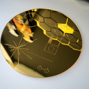 Mirrored Gold Acrylic Voyager Golden Record - an extraordinary gift capturing the essence of space and beyond. Explore the galaxy & universe
