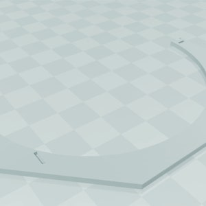 May include: White plastic ring with a 5-inch diameter. The ring is shaped like a hexagon with rounded corners.