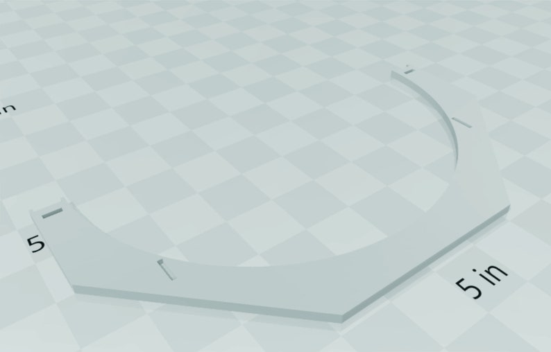 May include: White plastic ring with a 5-inch diameter. The ring is shaped like a hexagon with rounded corners.