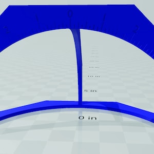 以下が含まれることがあります： 青いアーチ型の測定ツール。上部は湾曲し、ベースは平らです。ツールには、湾曲したエッジに沿ってインチのマークがあり、最大15 cmまで測定できます。垂直サポートがベースを上部に接続しています。