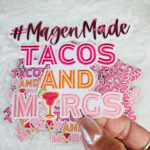 May include: A set of pink and white iron-on patches with the text "#MagenMade Tacos and Margaritas".