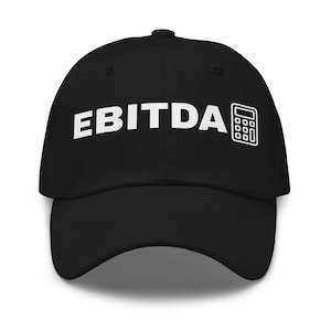May include: Black baseball cap with the word "EBITDA" in white block letters and a white calculator icon on the right side. The cap has a curved brim and a button on top.