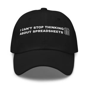 May include: Black baseball cap with the text "I CAN'T STOP THINKING ABOUT SPREADSHEETS" in white, along with a spreadsheet icon. The cap has a curved brim and a structured fit, suitable for casual wear.