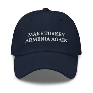 May include: A navy blue baseball cap with white embroidered text that reads "MAKE TURKEY ARMENIA AGAIN".