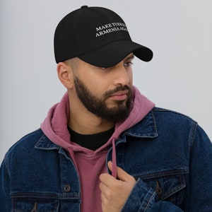 May include: A black baseball cap with white embroidered text that reads "MAKE TURKEY ARMENIA AGAIN".
