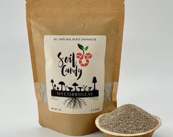 May include: A brown paper bag of "Soil Candy" mycorrhizae, a natural root enhancer, with a wooden bowl of the product in front. The label features a stylized design with mushrooms and the text "MYCORRHIZAE". The bag contains 1 lb of product, and the bowl holds 2.5 cups.