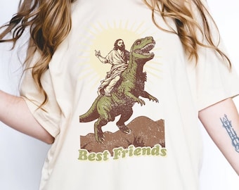 Jesus Riding A Dinosaur Shirt, Buddy Jesus Shirt, Novelty Shirt, Funny Dinosaur Shirt, Funny Religion Shirt, Jesus UFO Dinosaur
