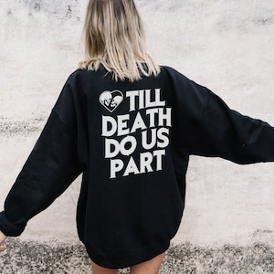 May include: Black sweatshirt with a white graphic print that says "Till Death Do Us Part" with a broken heart symbol.