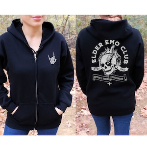 May include: Black zip-up hoodie with a skull graphic and the text "Elder Emo Club" on the back. The front of the hoodie has a skeleton hand making a rock and roll sign.