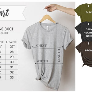 May include: Size chart for Bella + Canvas 3001 unisex jersey t-shirts. The chart shows sizes XS to 3XL with corresponding width, chest, and length measurements in inches. The chart is displayed next to a gray t-shirt on a hanger, with measurements marked on the shirt.