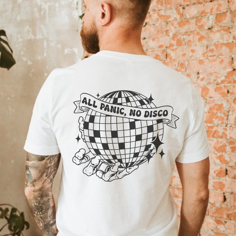 May include: White t-shirt with a black and white graphic of a disco ball being held by a skeletal hand. The text "ALL PANIC, NO DISCO" is on a banner above the disco ball.