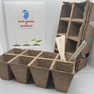 May include: A set of brown biodegradable seed starting trays with nine individual cells. The trays are made of compressed peat moss and are designed to be planted directly into the ground. The trays are accompanied by wooden sticks for stirring soil.