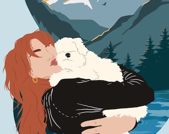 May include: A woman with long red hair is holding a white fluffy dog in her arms. She is looking at the dog and smiling. The background is a mountain scene with a lake in the foreground.