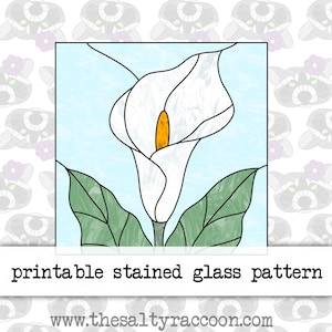 May include: Printable stained glass pattern of a white calla lily with green leaves on a light blue background. The pattern is for a stained glass project.