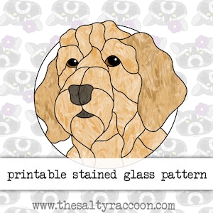 May include: Printable stained glass pattern of a golden retriever dog's head. The pattern is in a circle and the dog's head is facing forward. The dog's fur is a light brown color and the dog's nose is black.