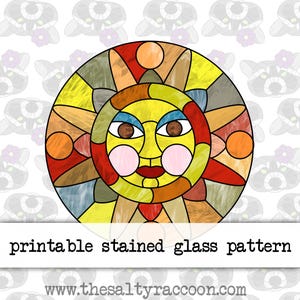 May include: Printable stained glass pattern of a sun with a yellow face, red lips, brown eyes, and pink cheeks. The sun is surrounded by a colourful geometric design.