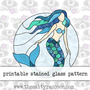 May include: Printable stained glass pattern of a mermaid with blue and green scales, flowing blue hair, and a light blue tail. The pattern is set against a light blue background with white waves.