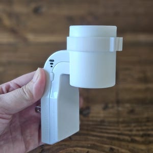 May include: White plastic plug-in nightlight with a round, white diffuser. The nightlight has a small, white button on the side.