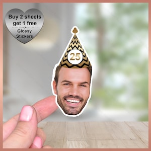 May include: A sticker featuring a man's face wearing a black and gold party hat with the number 25. The sticker also includes text that reads "Buy 2 sheets get 1 free" and "Glossy Stickers".