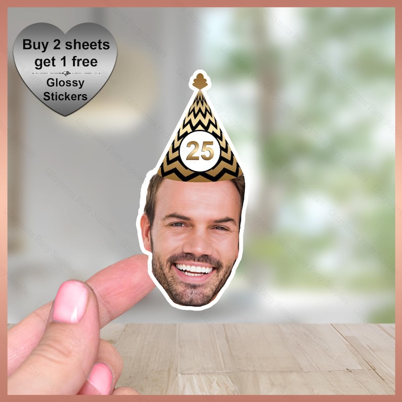 May include: A sticker featuring a man's face wearing a black and gold party hat with the number 25. The sticker also includes text that reads "Buy 2 sheets get 1 free" and "Glossy Stickers".
