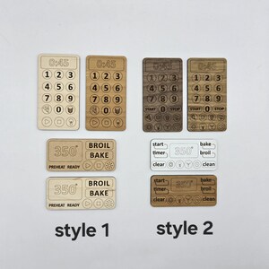 May include: Two styles of oven control panels made of wood. The first style has a timer, numbers 0-9, and buttons for start, stop, broil, and bake. The second style has buttons for start, timer, clear, bake, broil, and clean. Both styles have a temperature display that reads 350 degrees.