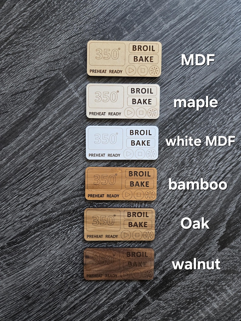 May include: Six wooden oven knobs with different wood finishes: MDF, maple, white MDF, bamboo, oak, and walnut. Each knob features a digital display with the temperature set to 350 degrees Fahrenheit, and buttons for broil and bake.