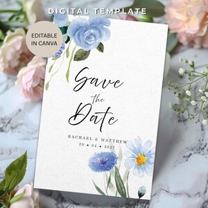 May include: A white card with blue watercolor floral accents, featuring the text "Save the Date." The card also includes the names "Rachael & Matthew" and the date "20.04.2027." The words "Digital Template" and "Editable in Canva" are also present.