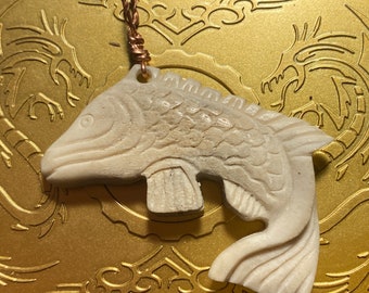 Carved fish in bone pendant, 2 inch