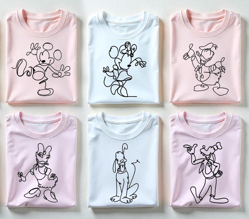 May include: Six folded t-shirts in pink and white, each featuring a black line drawing of a classic cartoon character. The characters include Mickey Mouse, Minnie Mouse, Donald Duck, Daisy Duck, Pluto, and Goofy.
