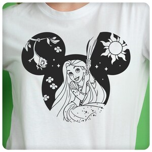 May include: Black and white illustration of Rapunzel from Disney's Tangled, with her hair flowing down and a chameleon on a branch. The illustration is inside a Mickey Mouse head silhouette.