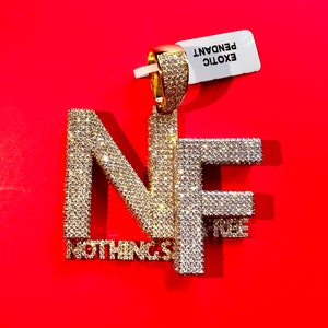 14kt 2tone finish Nothings free  pendant