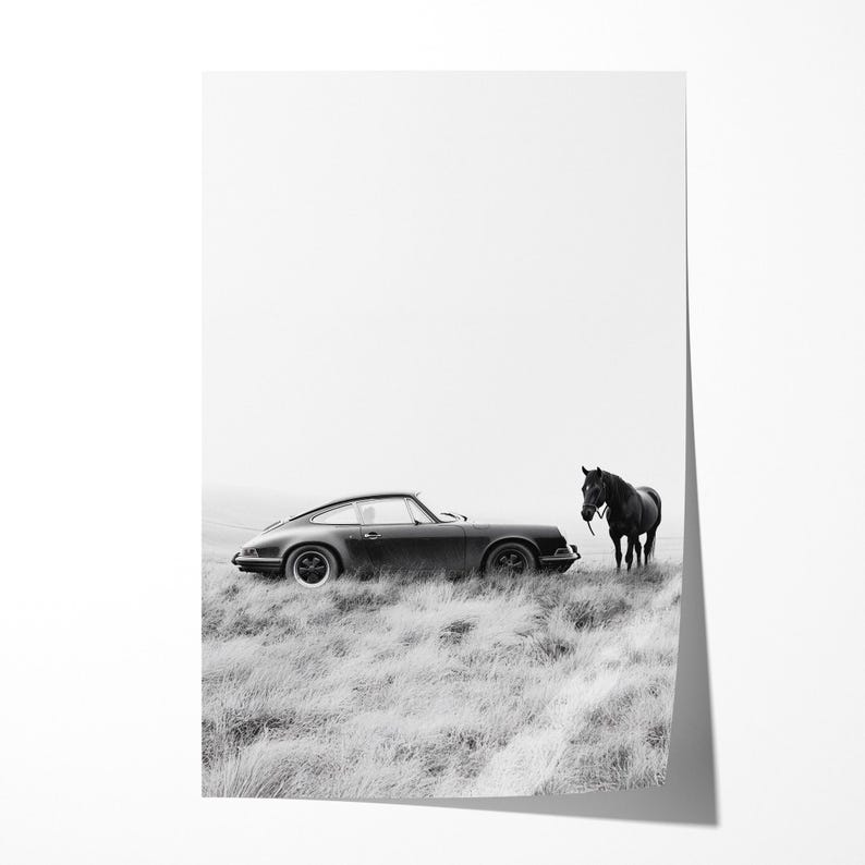 May include: Black and white photograph of a classic black Porsche 911 driving past a black horse in a field.