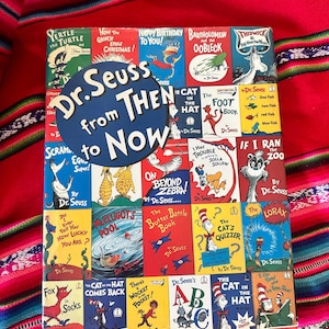 May include: A collection of Dr. Seuss books, featuring titles like "The Cat in the Hat" and "Green Eggs and Ham." The cover is a collage of colorful book covers, with the title "Dr. Seuss from Then to Now" in a blue circle.