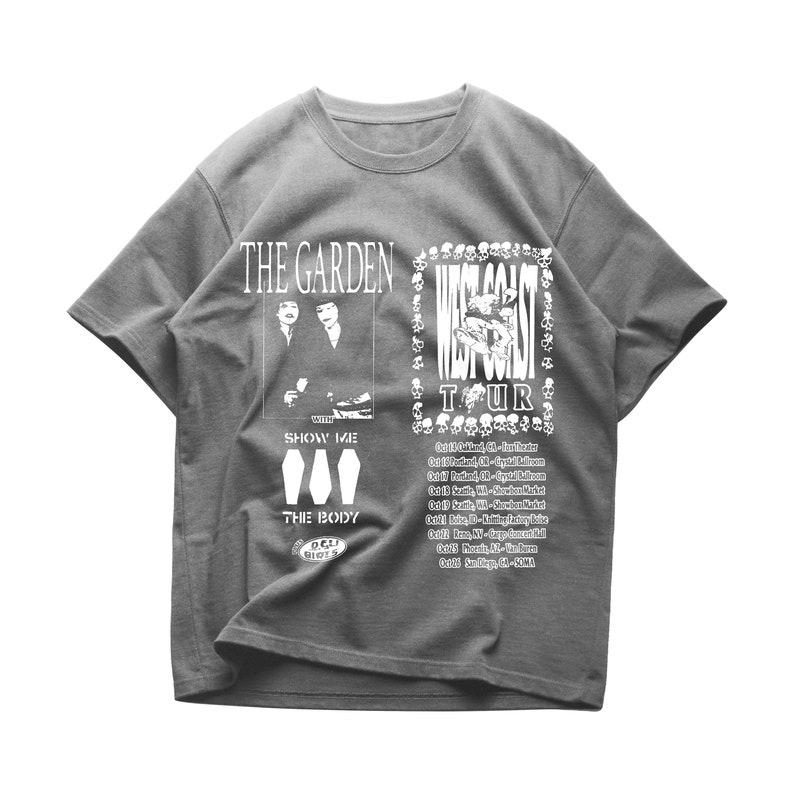 May include: Gray t-shirt with a white graphic print of a band called "The Garden" with the text "West Coast Tour" and a list of tour dates. The graphic features a skull and crossbones design.