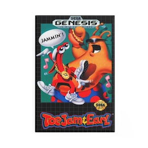 May include: A rectangular video game cartridge for "ToeJam & Earl." The image shows two cartoon characters, a red one and an orange one, with the word "JAMMIN'!" in a speech bubble. The Sega Genesis logo is at the top of the cartridge.