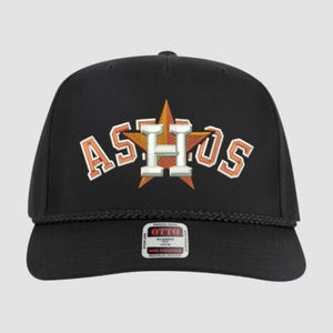 May include: Black baseball cap with the word "ASTROS" embroidered in orange and white, with a star in the center. The cap has a rope detail and a small tag that says "OTTO".