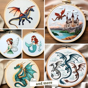 May include: Embroidered hoop art featuring various designs, including a blue and green dragon, a mermaid, a fairy, a castle, and a dragon with three heads. The hoops are made of wood and have a natural finish.