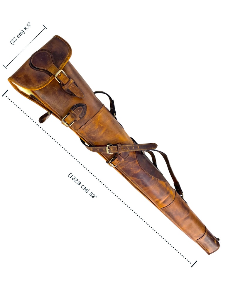 May include: A brown leather gun case with a strap and buckle. The case is 52 inches long and 8.5 inches wide.