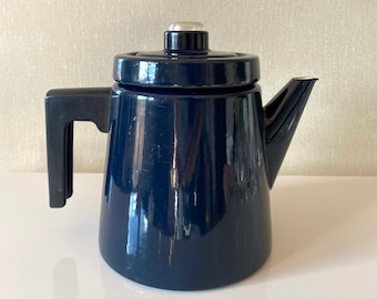 May include: A dark blue enamel coffee pot with a black handle and a silver lid.