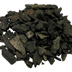 May include: A pile of black charcoal pieces, ideal for grilling or smoking.
