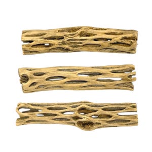 May include: Three pieces of dried cholla cactus wood, each with a unique, porous structure. The wood is a light tan color, with numerous holes and a textured surface. The pieces are arranged horizontally against a white background.