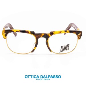 May include: Tortoise shell eyeglasses with gold metal frames and clear lenses. The brand name "JUNIOR" is printed on the right lens.