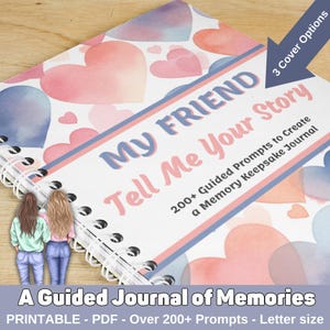 Puede incluir: Un diario rosa y azul con un diseño de corazón de acuarela y el texto "My Friend Tell Me Your Story" y "200+ Guided Prompts to Create a Memory Keepsake Journal". El diario está encuadernado en espiral y tiene un fondo blanco.