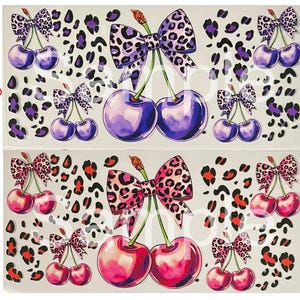 May include: Two sheets of stickers featuring watercolor cherries with leopard print bows. One sheet has purple cherries and bows, the other has pink cherries and bows. Both sheets have a leopard print background.