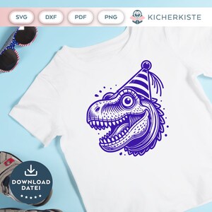 May include: A white t-shirt with a blue dinosaur wearing a striped party hat. The dinosaur is smiling and has a large eye. The text "DOWNLOAD DATEI" is on a blue circle below the dinosaur.